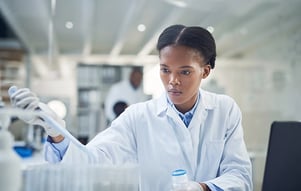 laboratory-technician-injecting-test-tube