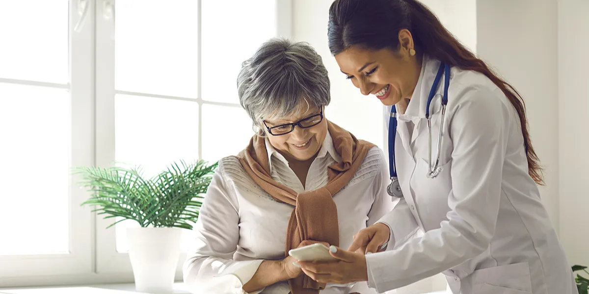 Healthcare worker showing patient something